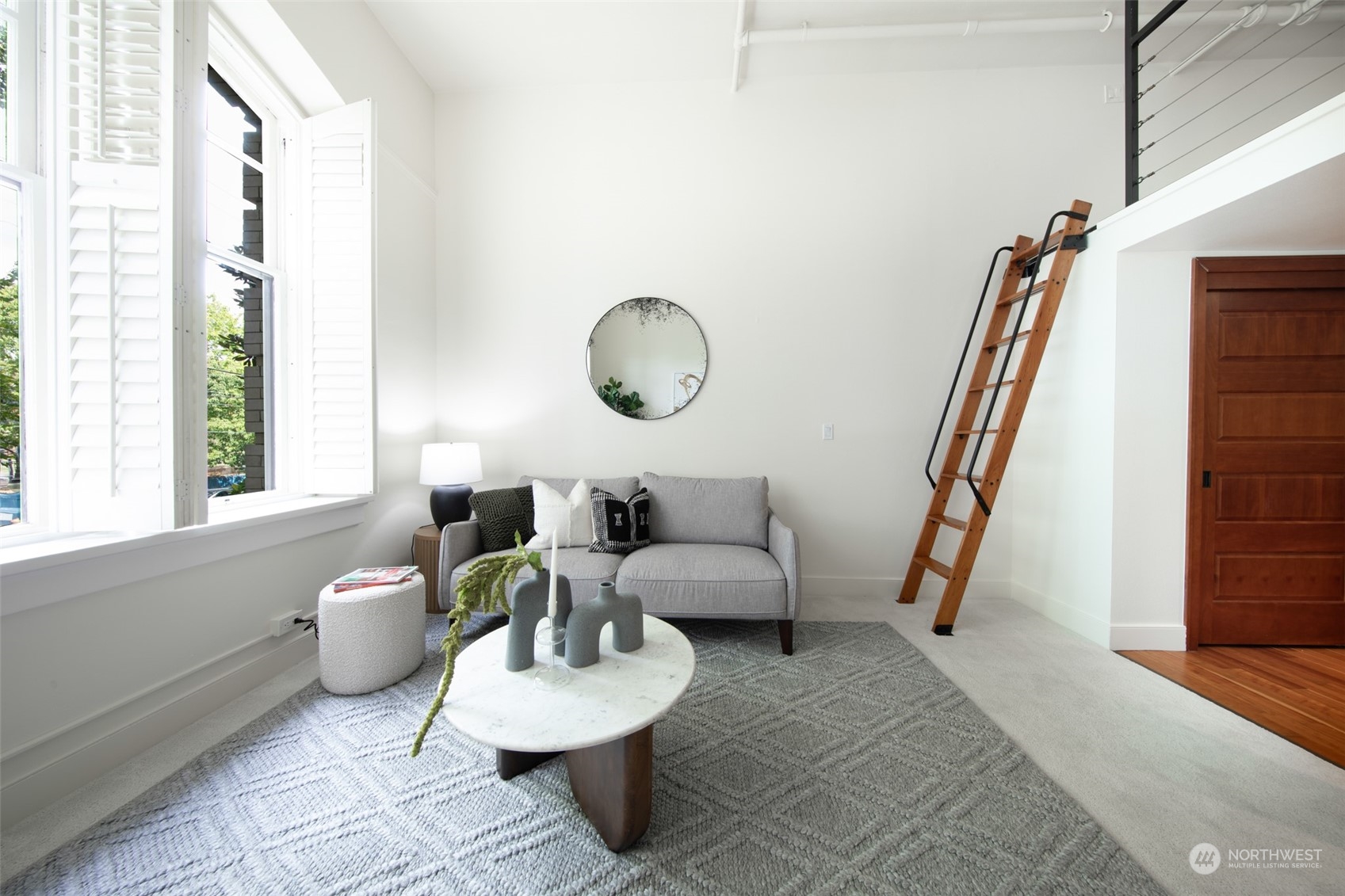 201 Galer Street, Unit 334 Seattle, WA 98109 - Photo 12 of 19 a living room with furniture and a rug