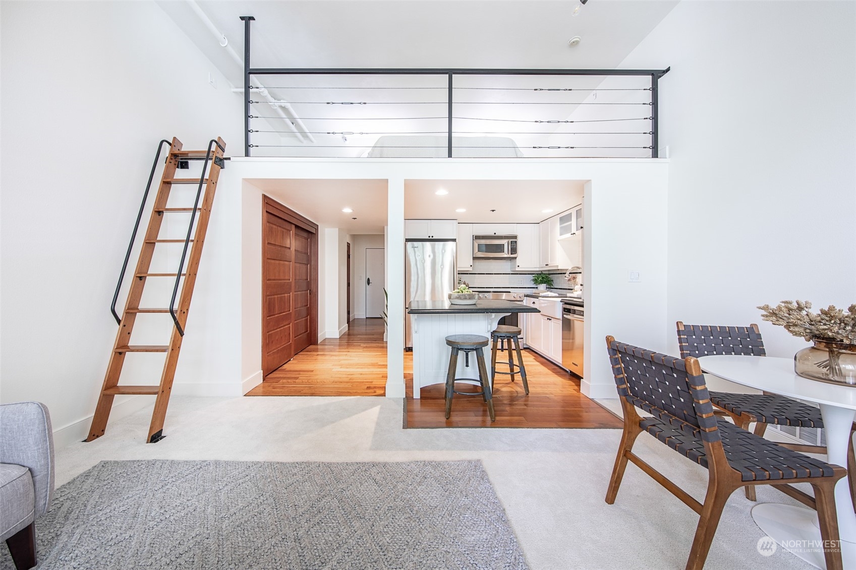 201 Galer Street, Unit 334 Seattle, WA 98109 - Photo 13 of 19 a view of a livingroom with furniture and wooden floor