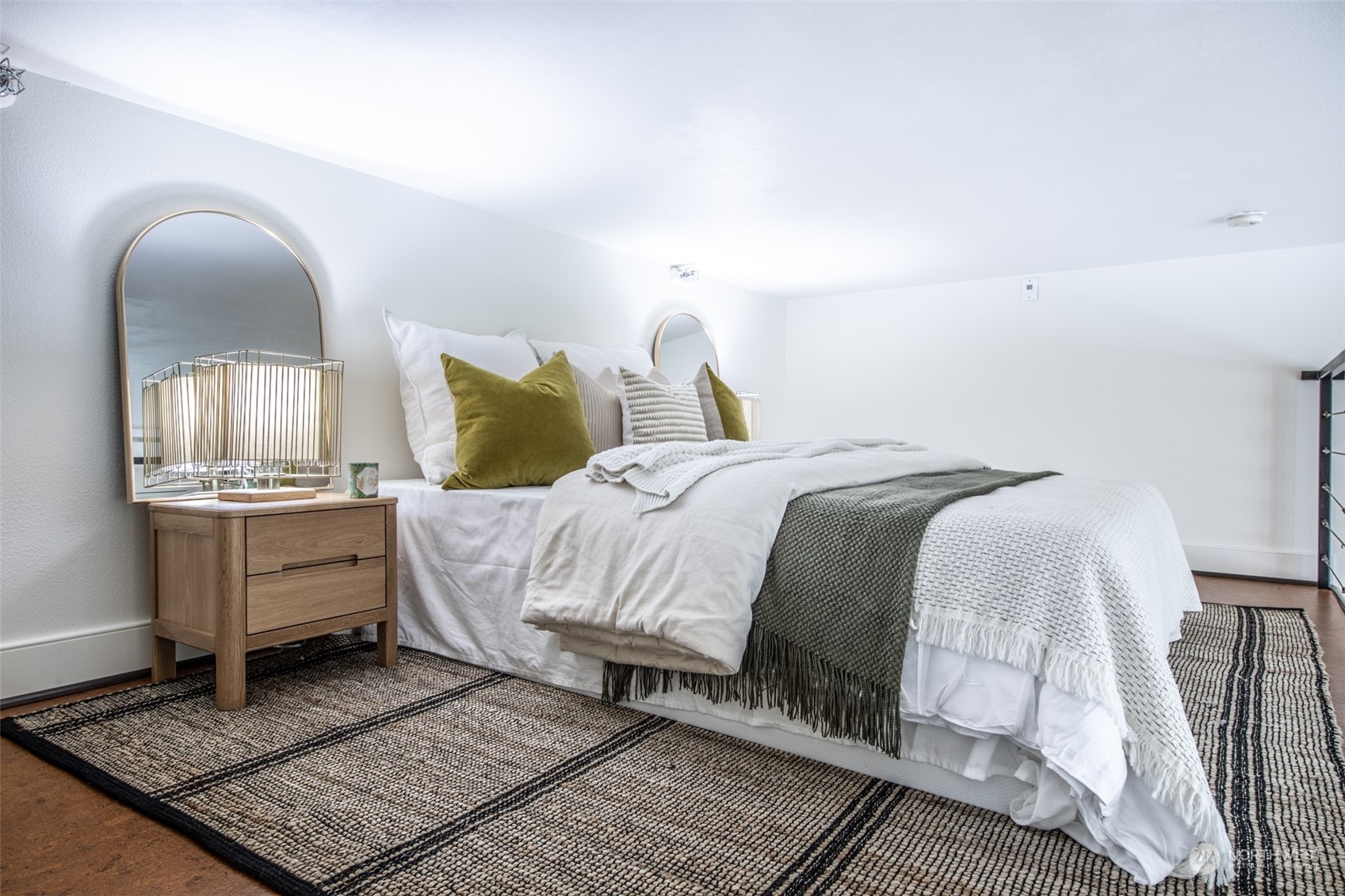 201 Galer Street, Unit 334 Seattle, WA 98109 - Photo 14 of 19 a bed sitting in a bedroom next to a window