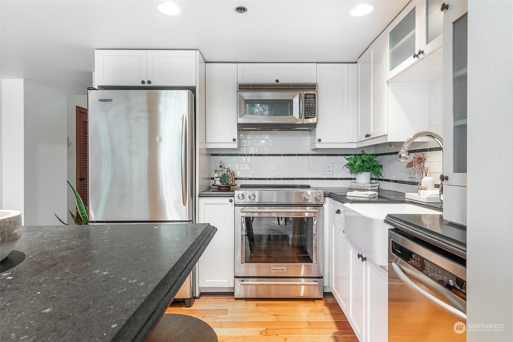 201 Galer Street, Unit 334 Seattle, WA 98109 - Photo 5 of 19 a kitchen with a refrigerator and a sink