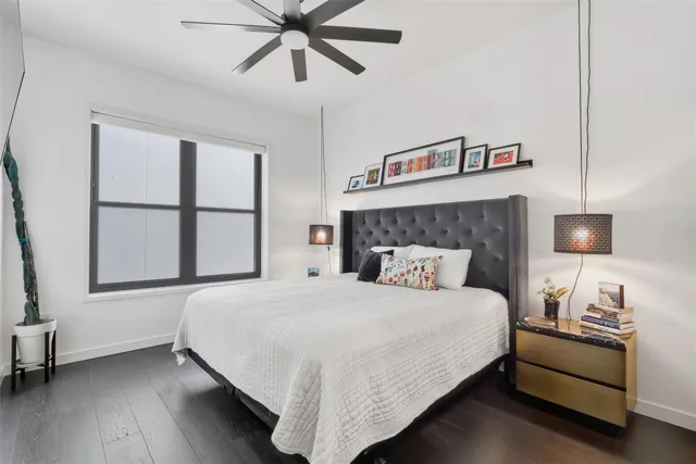 a bedroom with a large bed and a window