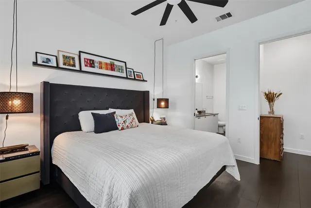 a bedroom with a bed and a lamp