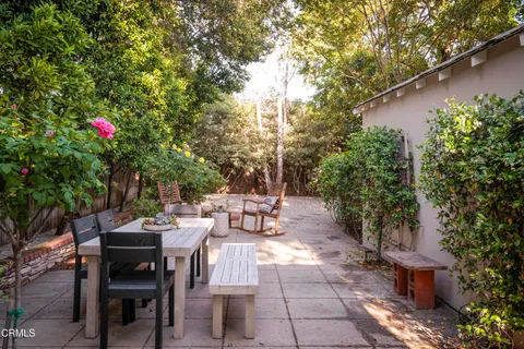 a view of a tables and chairs in a patio
