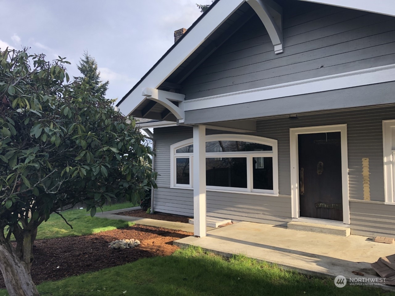 a view of house with yard