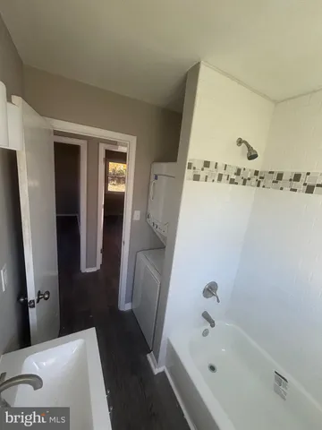 a bathroom with a bathtub and a sink