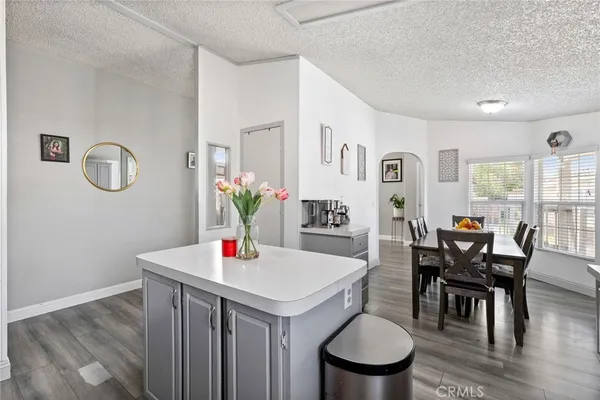 a bedroom with furniture and a book shelf