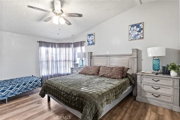 a bathroom with a tub a sink and a large mirror