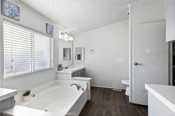 a view of a chairs and table in backyard