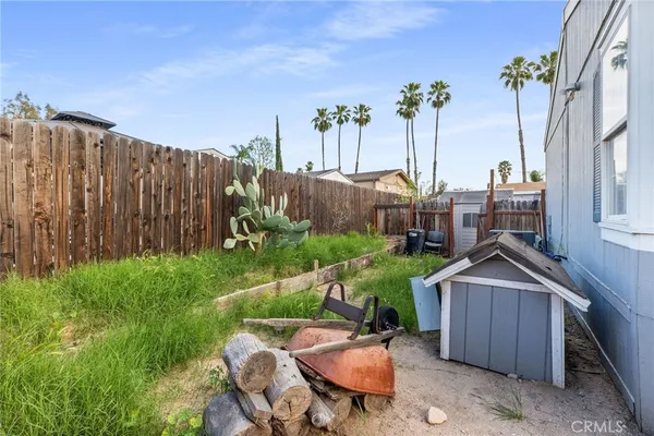 an aerial view of residential houses with outdoor space and parking