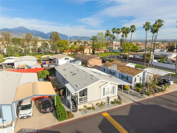 a buildings covered with tall trees