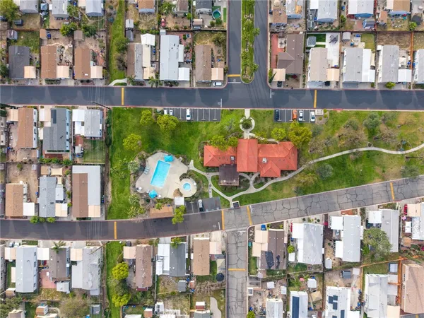 a view of a house with a yard and sitting area