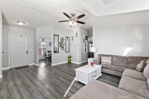 a view of a livingroom with furniture and wooden floor