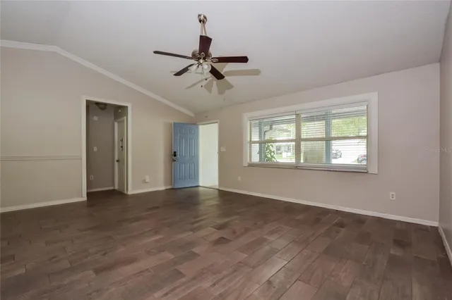 a view of an empty room with a window