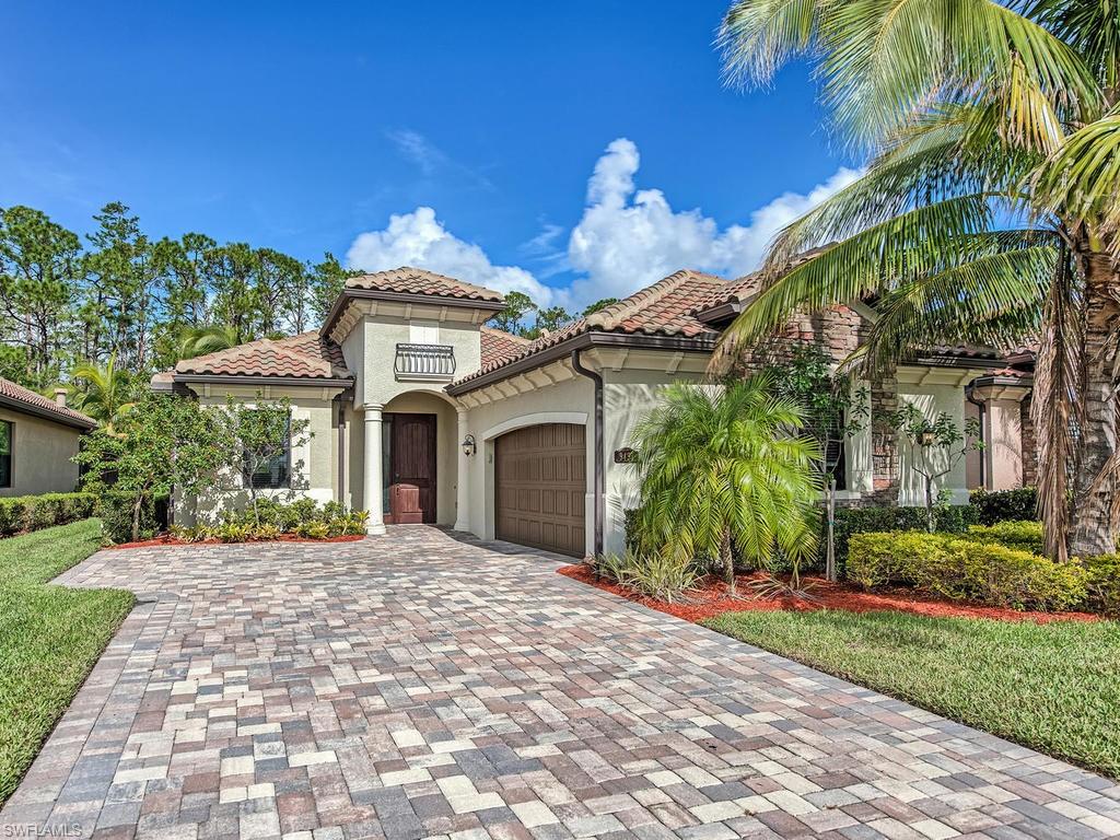 9491 Piacere Way Naples, FL 34113 - Photo 2 of 34 a front view of a house with a yard and potted plants