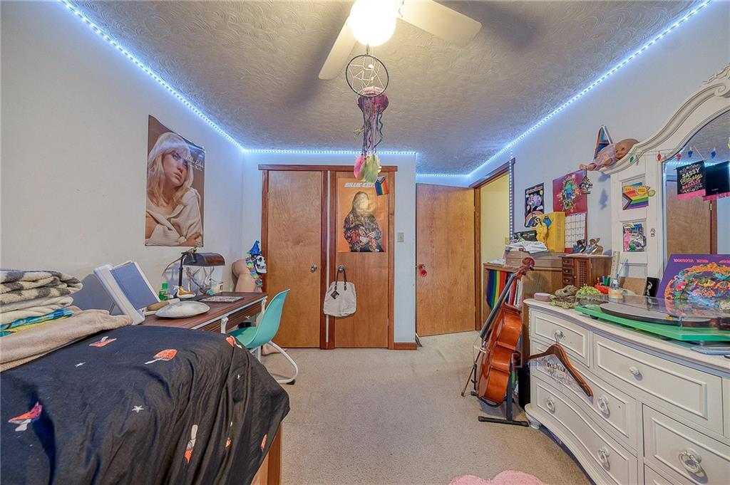 148-149 Soaring Eagle Sarver, PA 16055 - Photo 19 of 20 a bedroom with bed and a chandelier