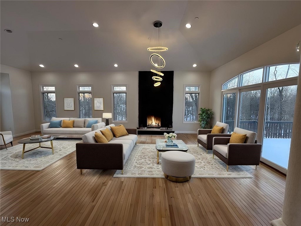 31295 Arthur Road Solon, OH 44139 - Photo 9 of 50 Living room with a large fireplace and light hardwood / wood-style flooring