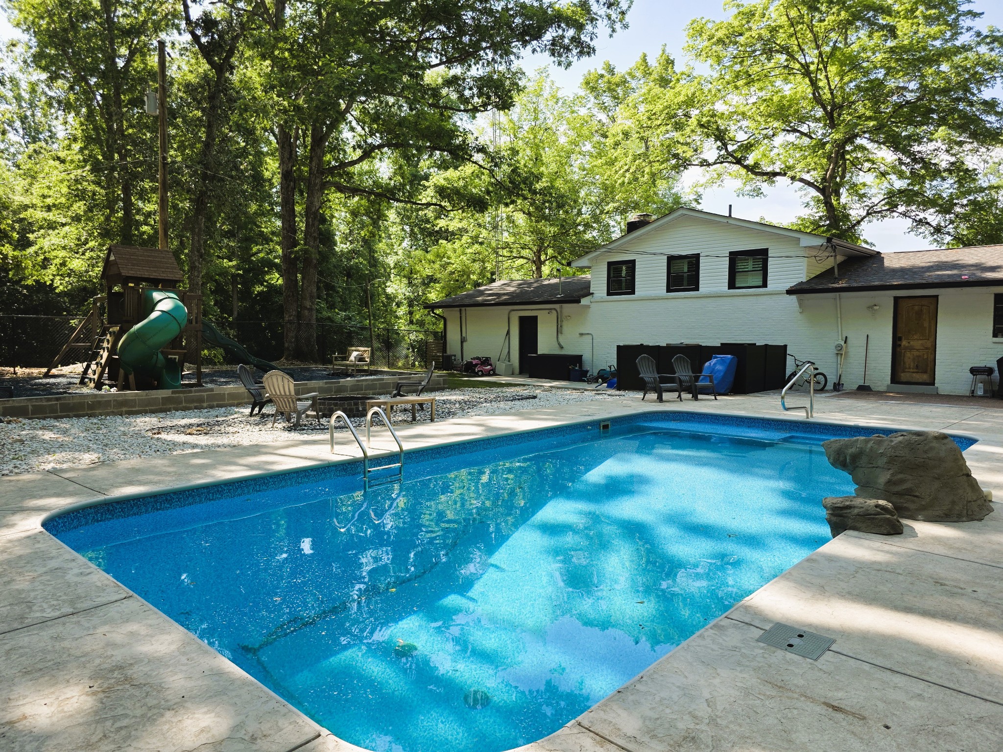 1975 Kelly Road Holladay, TN 38341 - Photo 7 of 95 a view of a house with swimming pool and sitting area