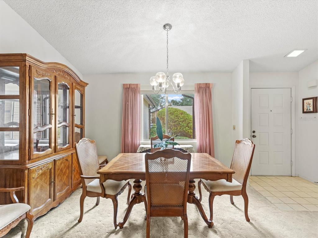 7415 Heather Walk Drive Weeki Wachee, FL 34613 - Photo 2 of 35 a view of a dining room with furniture window and outside view