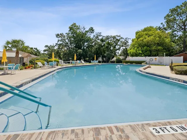a view of a patio with swimming pool