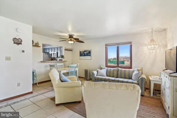 a living room with furniture and a table
