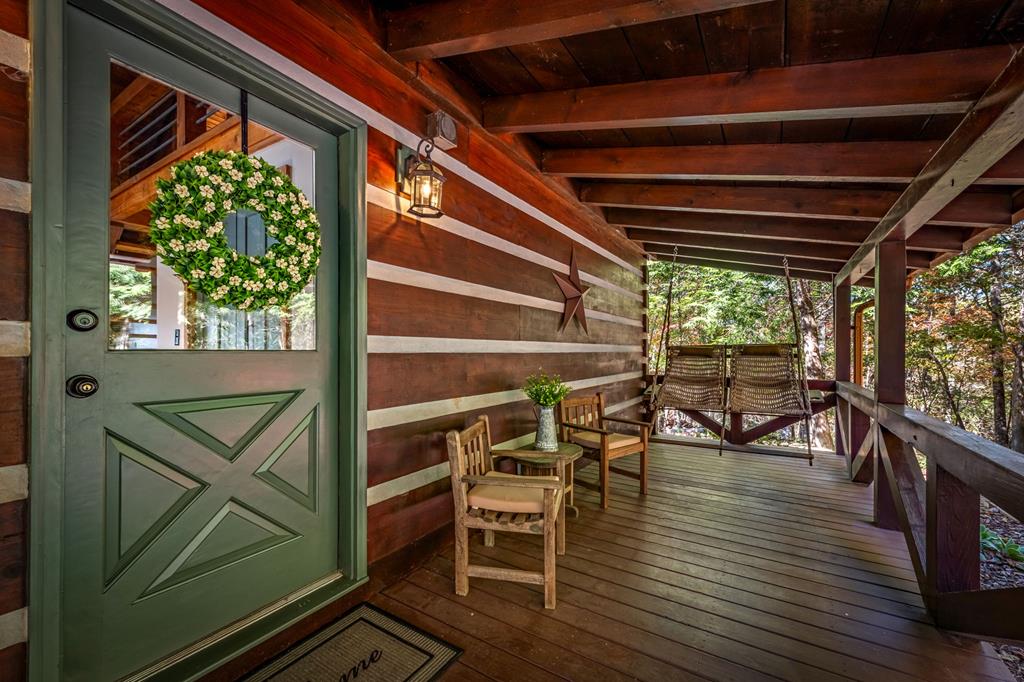 212 Dogpatch Lane Blue Ridge, GA 30513 - Photo 12 of 70 a view of a chairs and table on the wooden floor