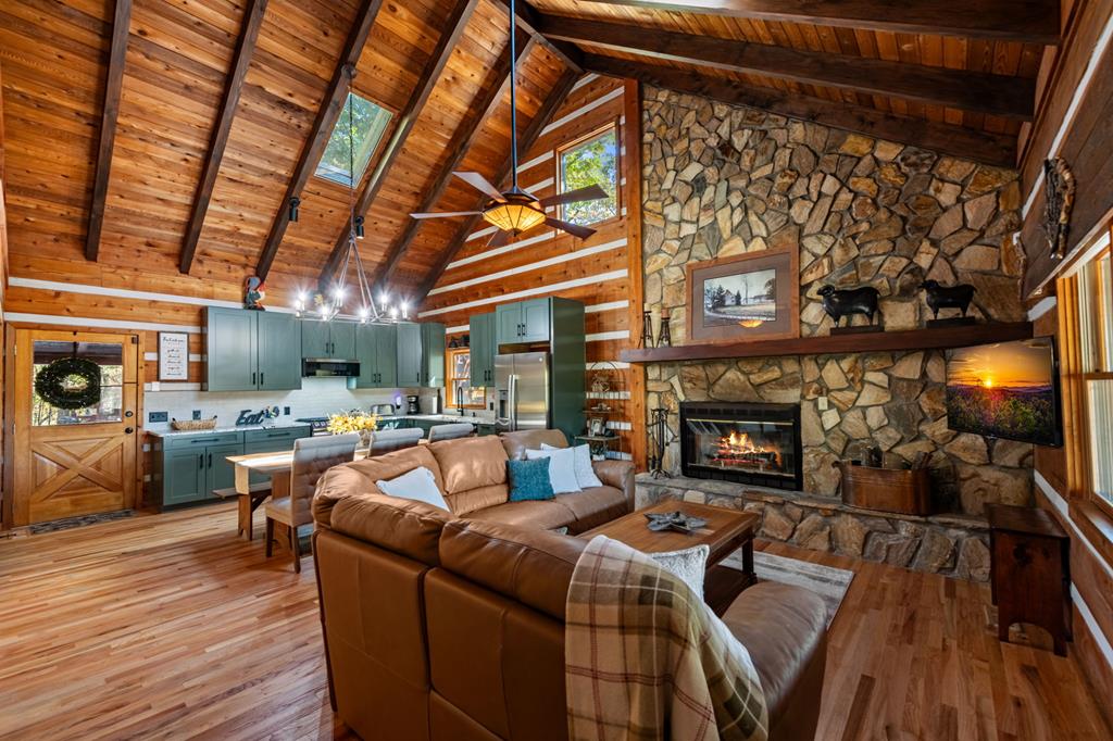 212 Dogpatch Lane Blue Ridge, GA 30513 - Photo 18 of 70 a living room with furniture and a fireplace