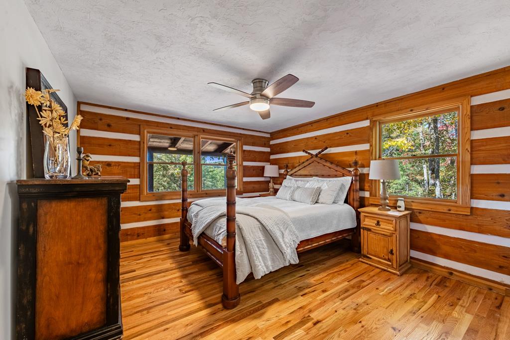 212 Dogpatch Lane Blue Ridge, GA 30513 - Photo 21 of 70 a bed room with a bed and a window