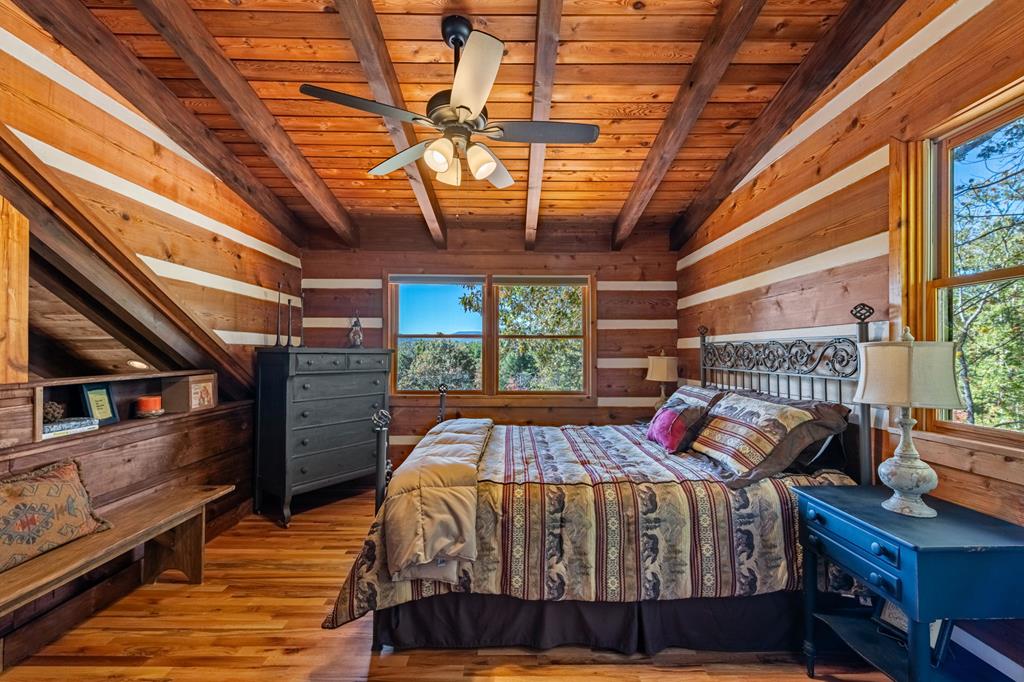 212 Dogpatch Lane Blue Ridge, GA 30513 - Photo 25 of 70 a bed room with a bed and a window