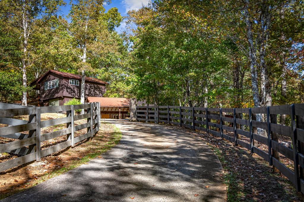 212 Dogpatch Lane Blue Ridge, GA 30513 - Photo 35 of 70 a view of a house with backyard and sitting area
