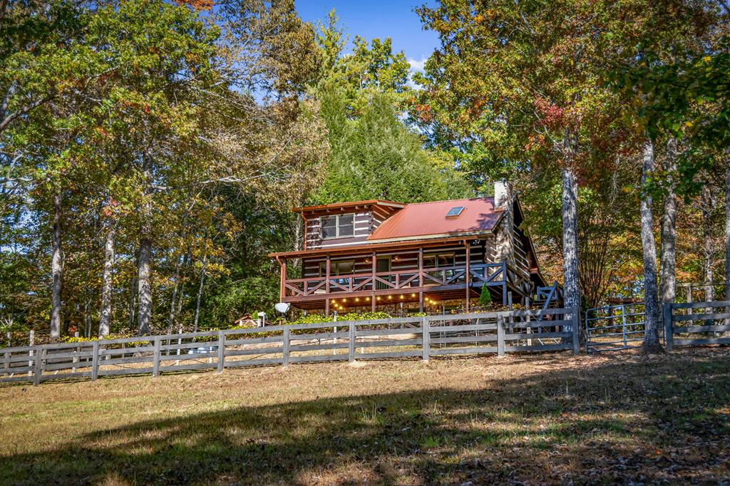 212 Dogpatch Lane Blue Ridge, GA 30513 - Photo 39 of 70 a view of a house with pool and a big yard