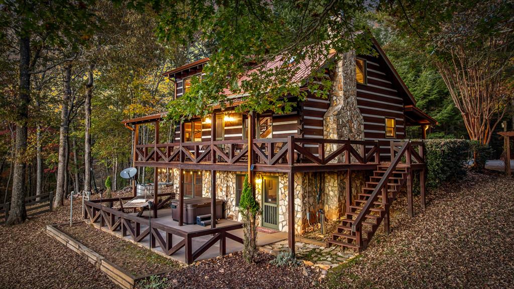 212 Dogpatch Lane Blue Ridge, GA 30513 - Photo 4 of 70 a view of a chairs and table in the patio