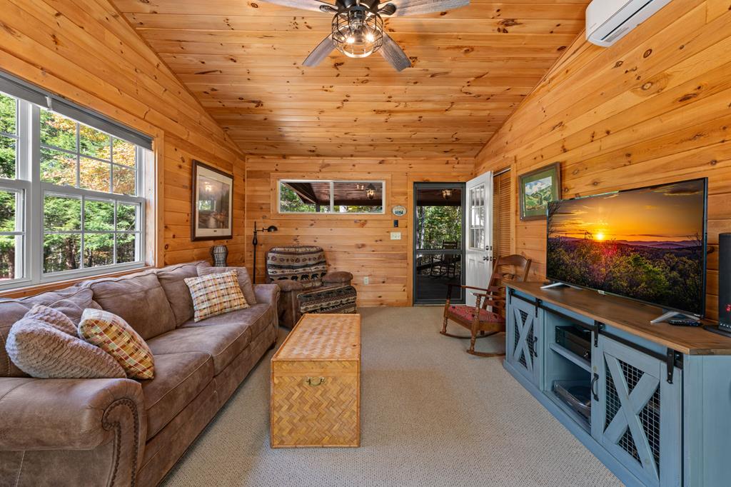 212 Dogpatch Lane Blue Ridge, GA 30513 - Photo 46 of 70 a living room with furniture and a flat screen tv