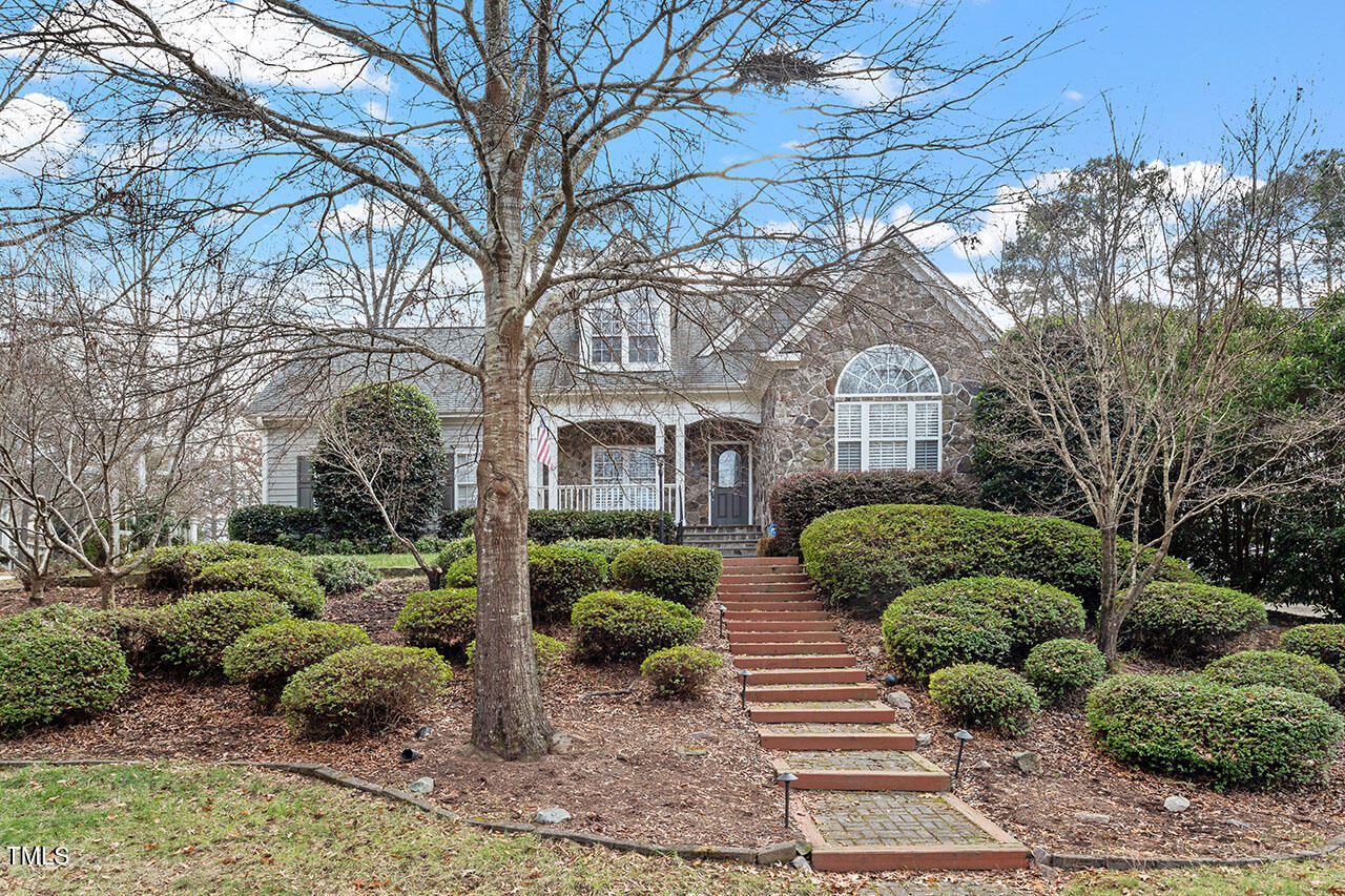 1121 Coram Fields Road Wake Forest, NC 27587 - Photo 2 of 3 a front view of a house with garden