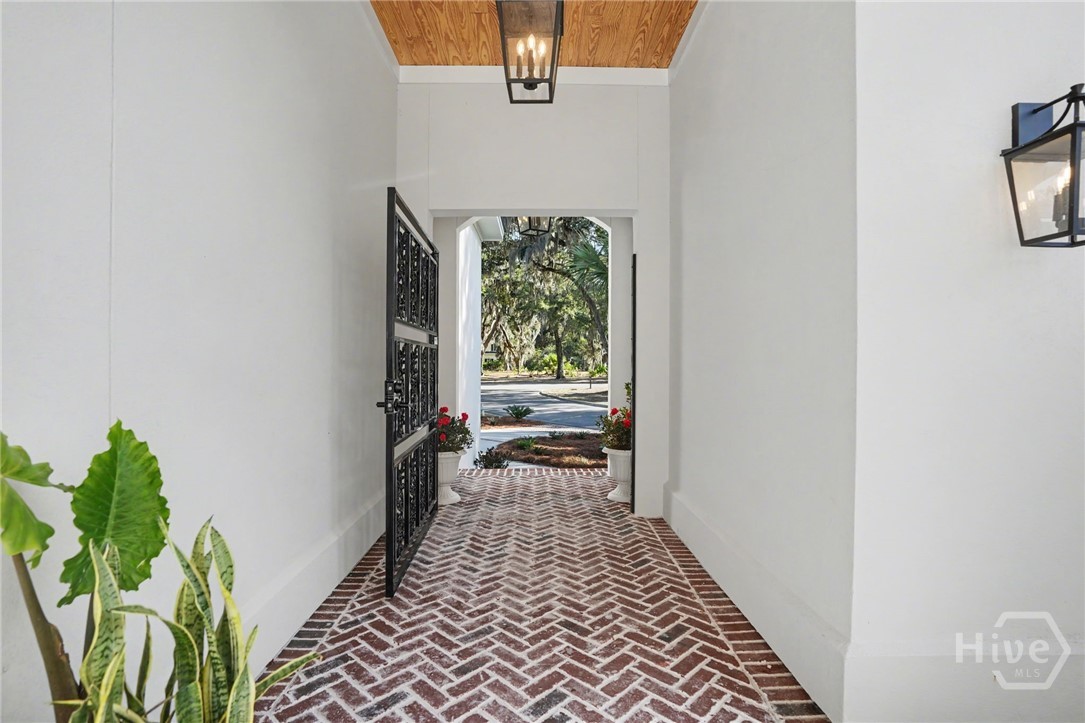 2 Top Gallant Circle Savannah, GA 31411 - Photo 5 of 40 Enter the iron gate into the brick courtyard that separates the main part of the home from the main level guest suite.