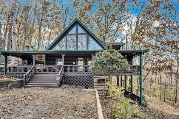 a kitchen with stainless steel appliances granite countertop a refrigerator a stove and a wooden floors