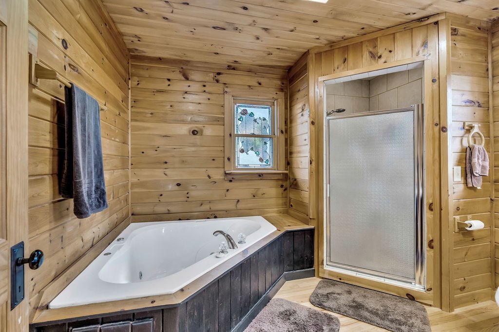 116 Channing Ridge Road Morganton, GA 30560 - Photo 18 of 62 a bathroom with a tub and shower
