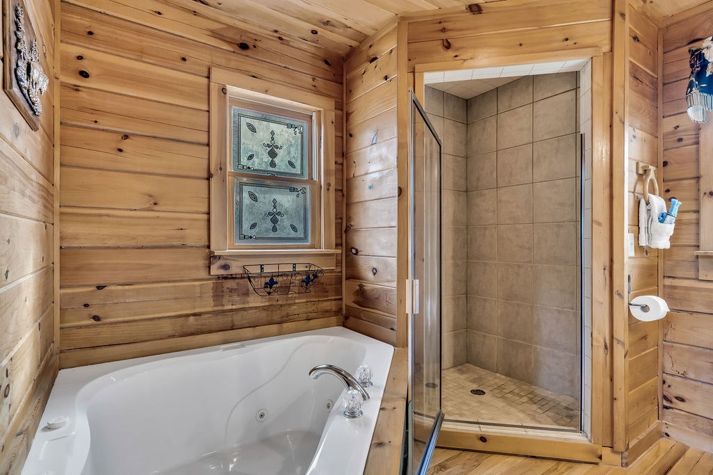 116 Channing Ridge Road Morganton, GA 30560 - Photo 31 of 62 a bathroom with a bathtub and shower