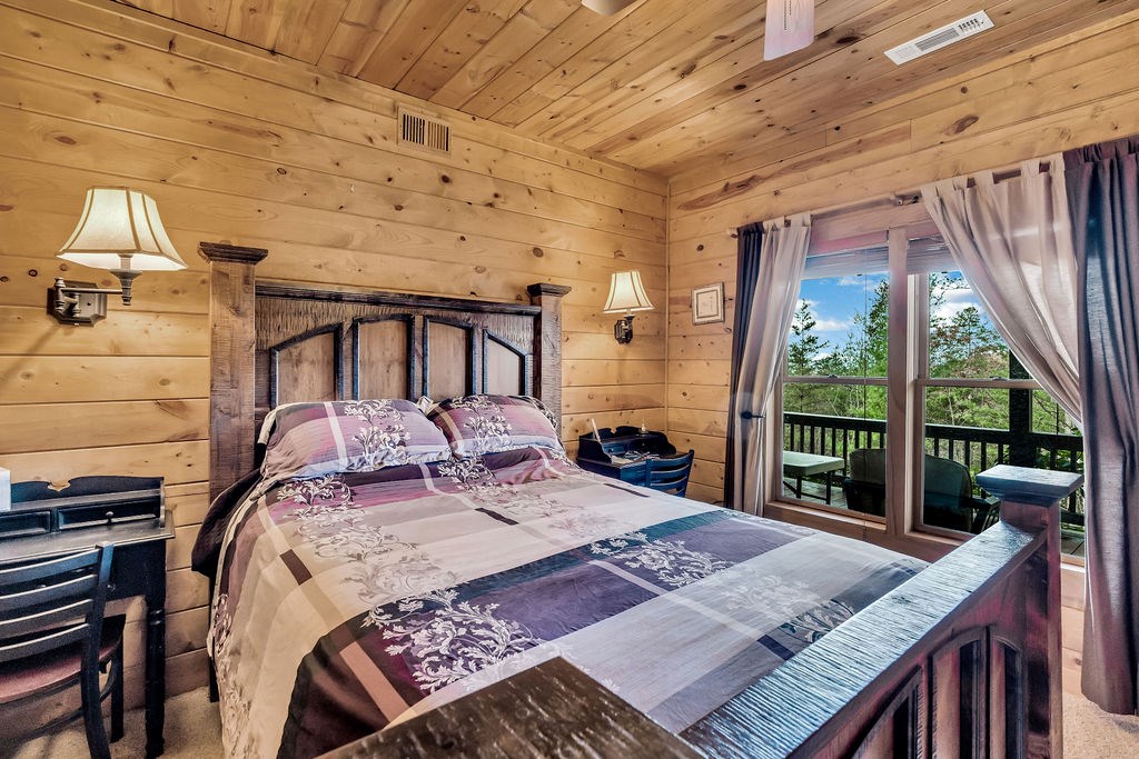 116 Channing Ridge Road Morganton, GA 30560 - Photo 38 of 62 a bed sitting in a bedroom next to a large window