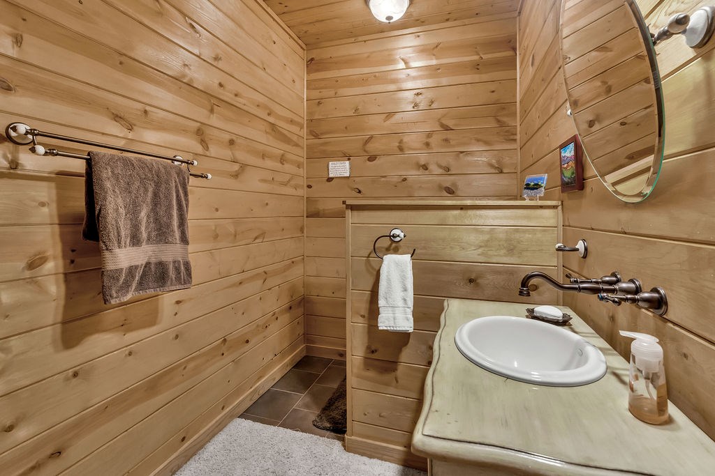 116 Channing Ridge Road Morganton, GA 30560 - Photo 40 of 62 a bathroom with a sink and a mirror