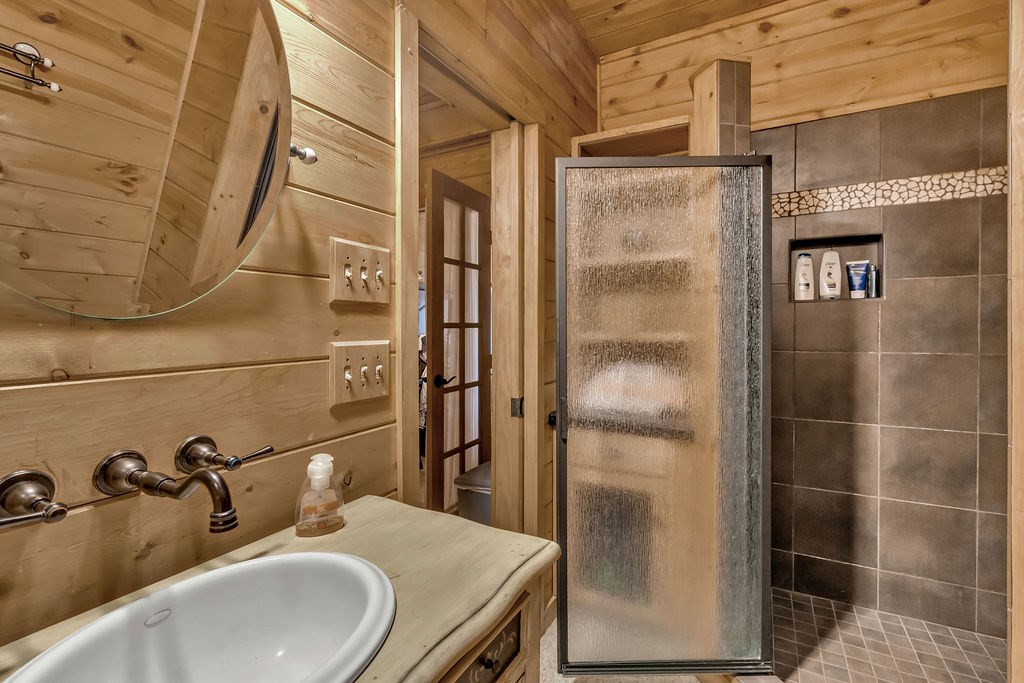116 Channing Ridge Road Morganton, GA 30560 - Photo 41 of 62 a bathroom with a sink and mirror