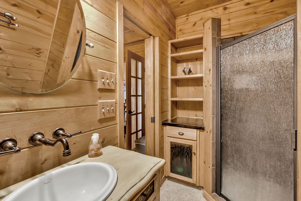 116 Channing Ridge Road Morganton, GA 30560 - Photo 42 of 62 a bathroom with a sink and mirror