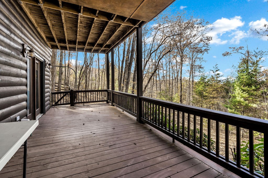 116 Channing Ridge Road Morganton, GA 30560 - Photo 44 of 62 a view of a porch with wooden floor and fence