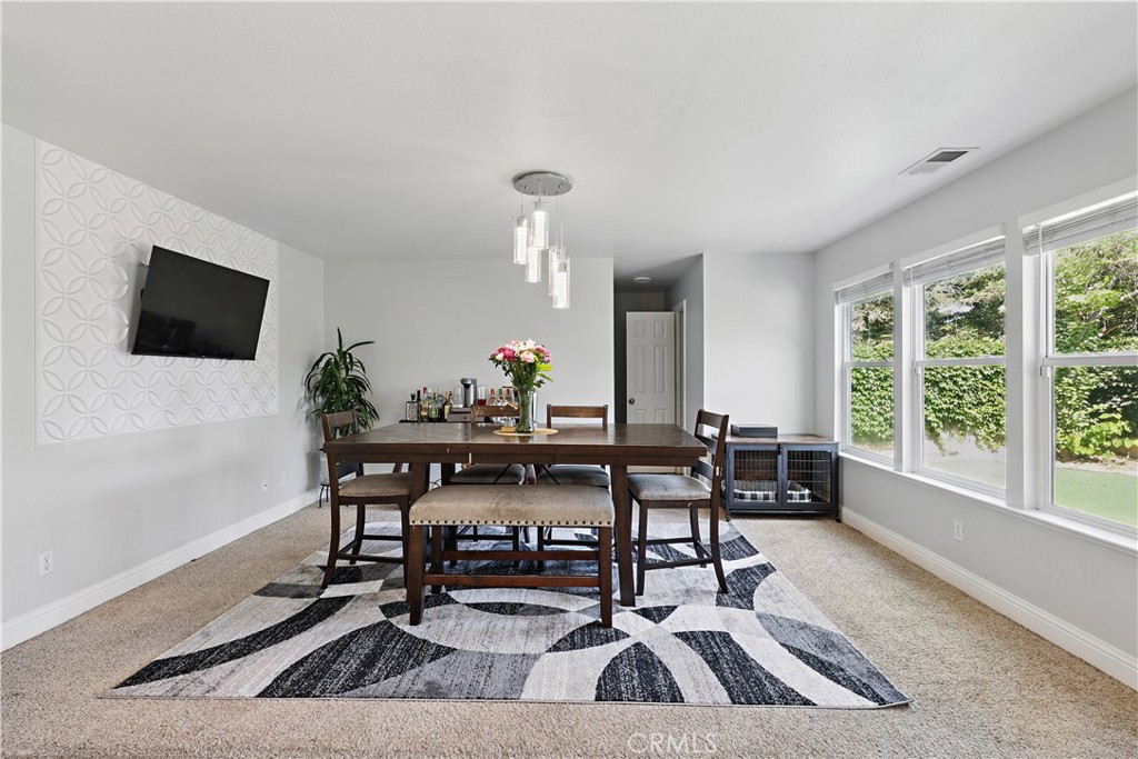 1235 Sunrise Drive Merced, CA 95348 - Photo 18 of 44 a view of a workspace with furniture and a potted plant