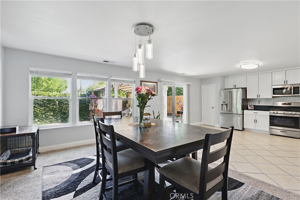 1235 Sunrise Drive Merced, CA 95348 - Photo 19 of 44 a dining room with furniture and window