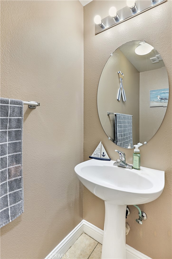 1235 Sunrise Drive Merced, CA 95348 - Photo 20 of 44 a bathroom with a sink a mirror and vanity
