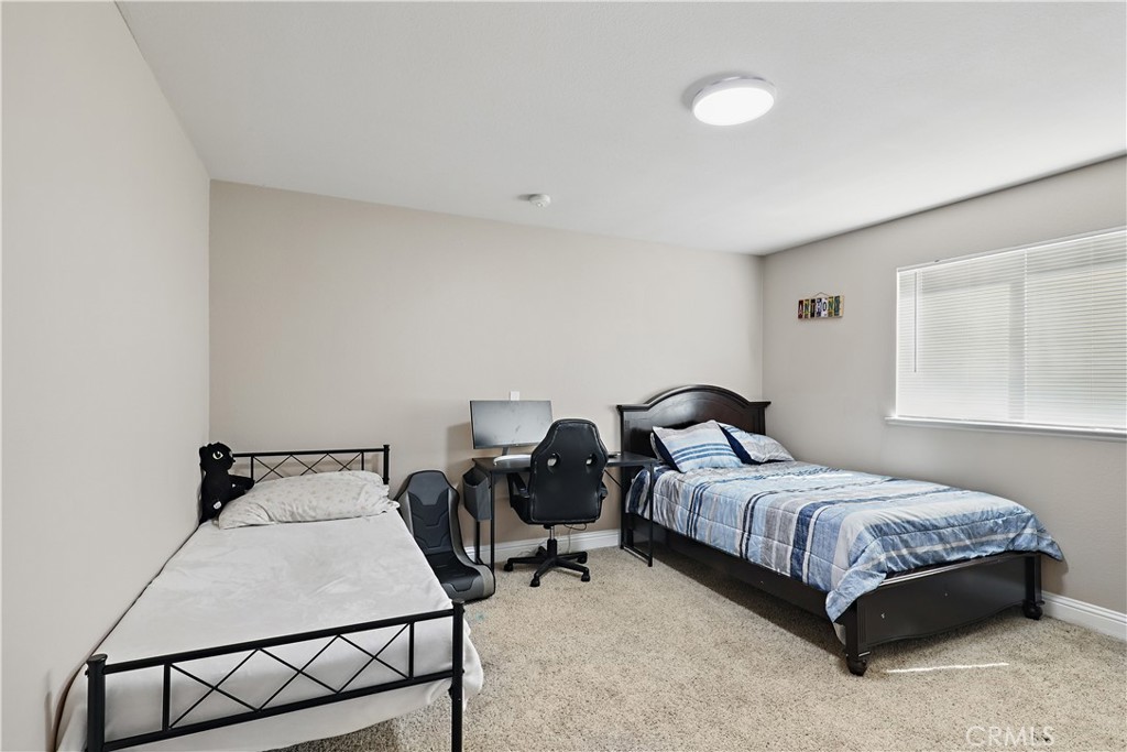 1235 Sunrise Drive Merced, CA 95348 - Photo 28 of 44 a bedroom with a bed and window