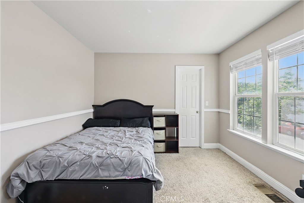 1235 Sunrise Drive Merced, CA 95348 - Photo 30 of 44 a bed sitting in a bedroom next to a window