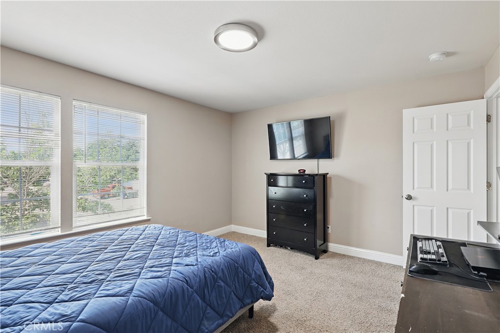 1235 Sunrise Drive Merced, CA 95348 - Photo 34 of 44 a bedroom with a bed and a tv