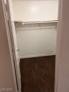 1440 East Vegas Valley Drive, Unit 7 Las Vegas, NV 89169 - Photo 12 of 19 Walk in closet with dark wood-type flooring