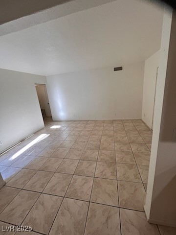 1440 East Vegas Valley Drive, Unit 7 Las Vegas, NV 89169 - Photo 17 of 19 Empty room featuring light tile patterned flooring